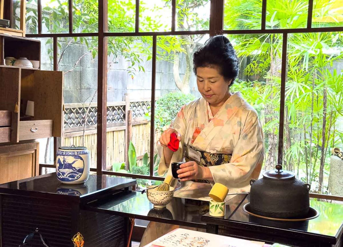 The master's first pour, held in silence — Kyoto, Japan